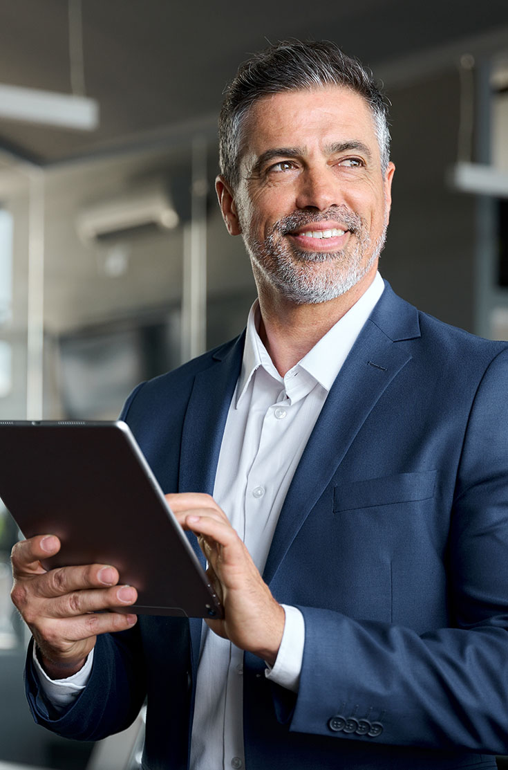 Image showing a business man holding a tablet