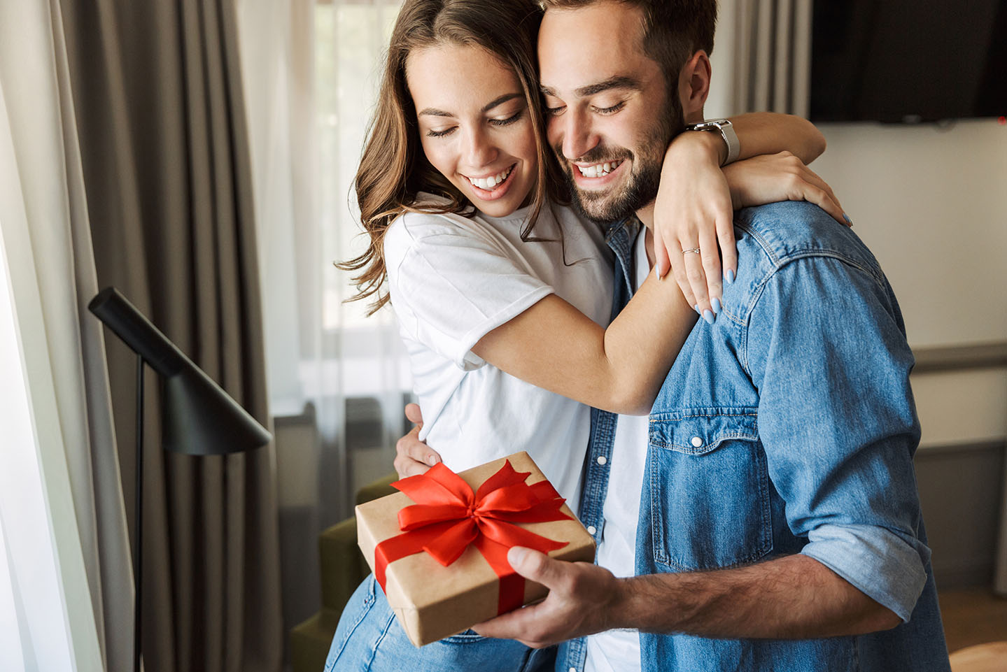 Image showing a happy couple with a gift