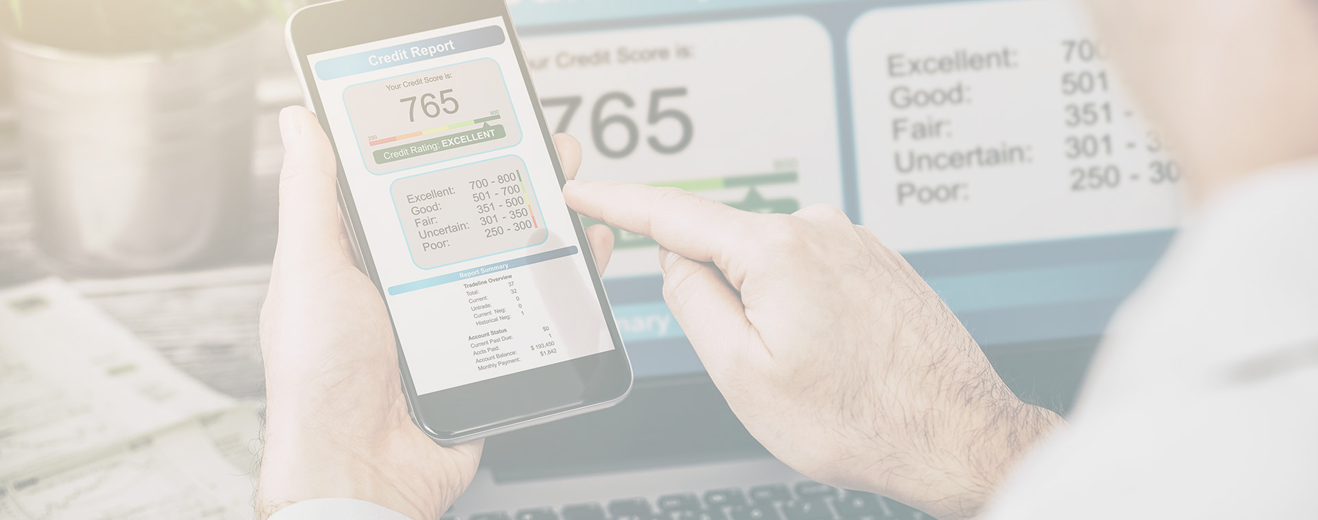 Image showing a man looking at his credit score on his phone