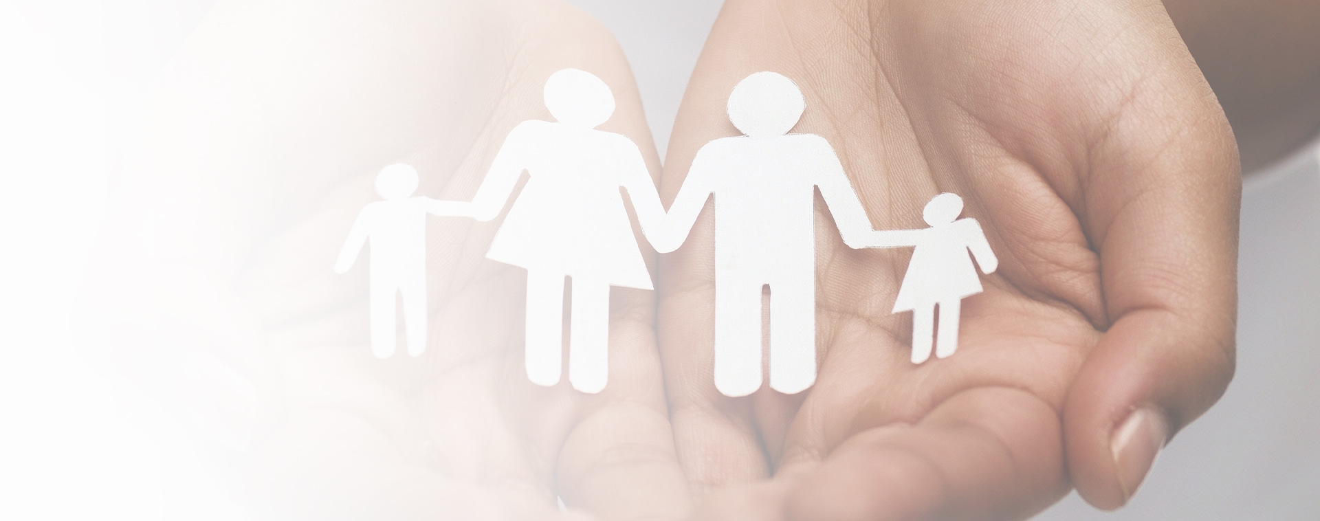 Image showing a pair of hands holding a paper family