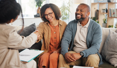Image showing a happy couple talking with a women