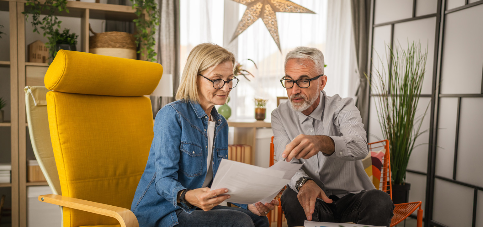 Senior couple looking at documents